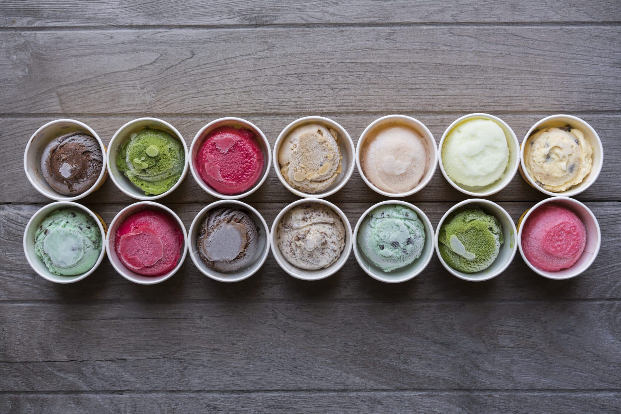 A spread of Baci Gelato flavors in tasting cups